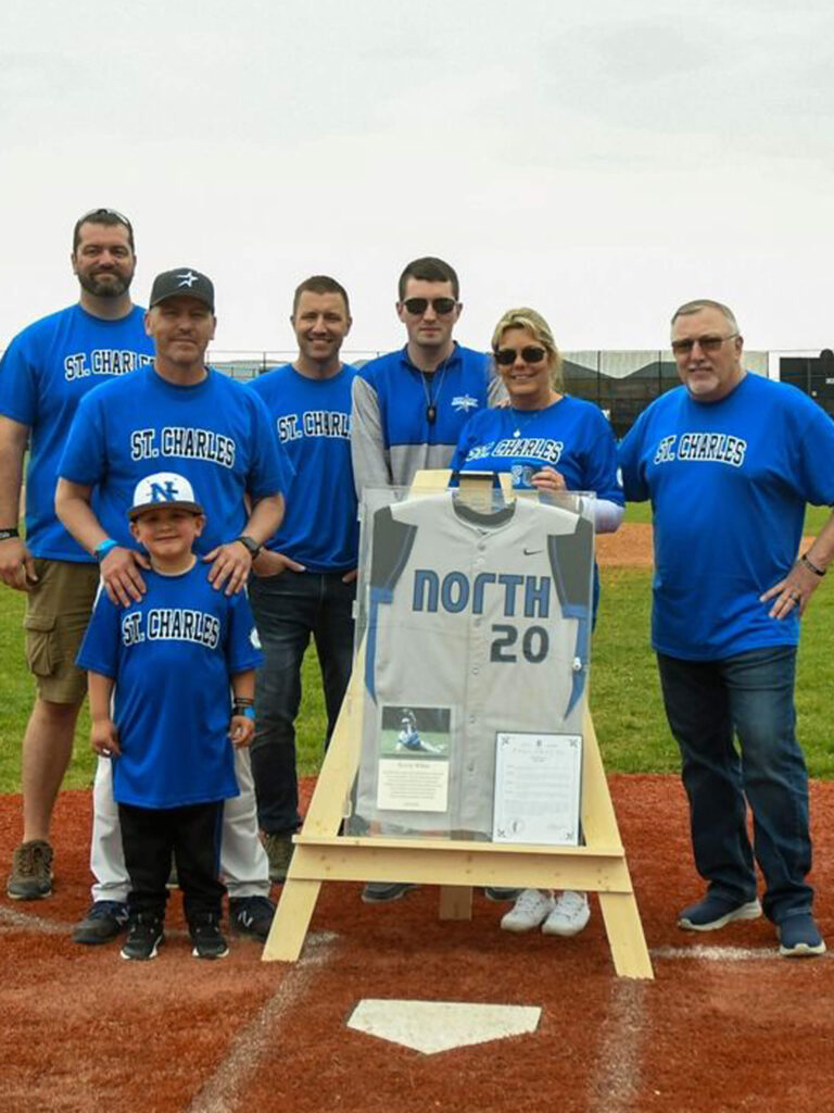 St. Charles North coach Todd Genke and the family of Kevin White